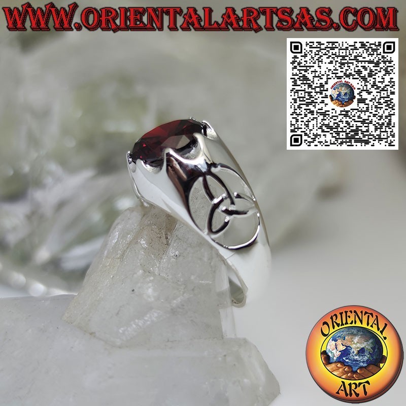 Silver ring with round garnet set and tyrone knot on the sides