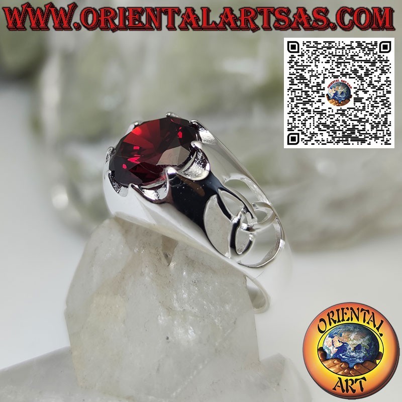 Silver ring with round garnet set and tyrone knot on the sides