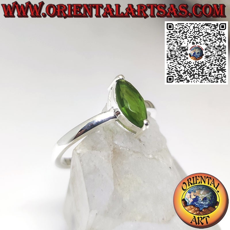 Silver ring set with faceted shuttle peridot