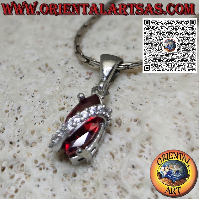 Silver pendant with shuttle garnet topped with zircons
