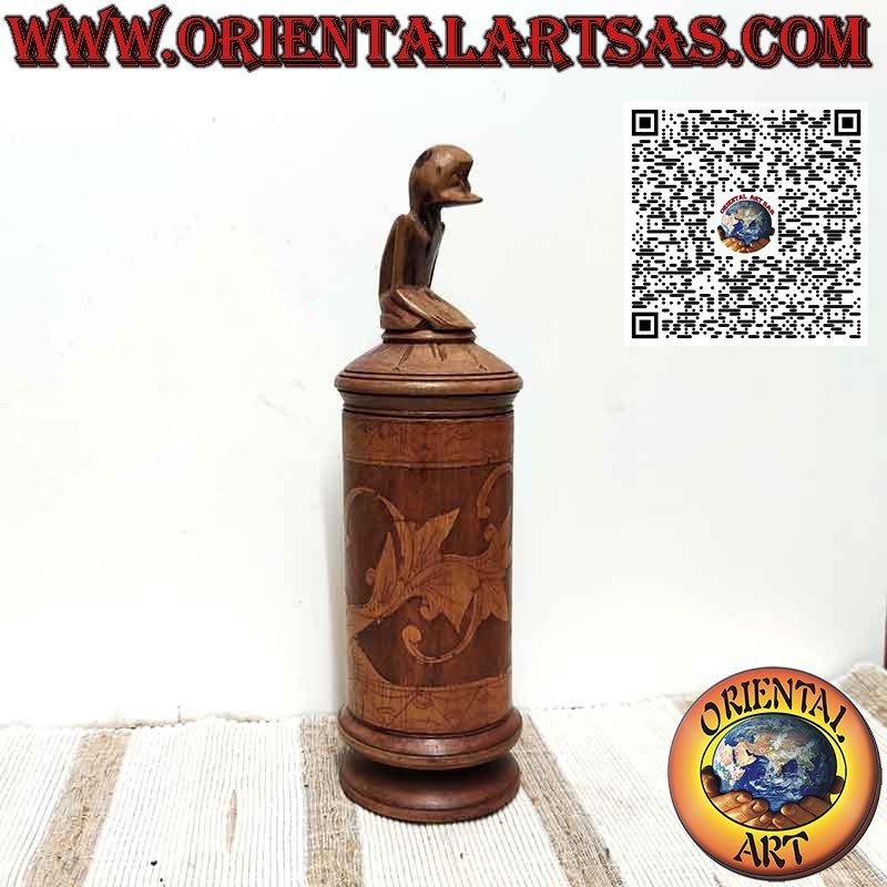 Bamboo medicine container and sculpture on Batak cap