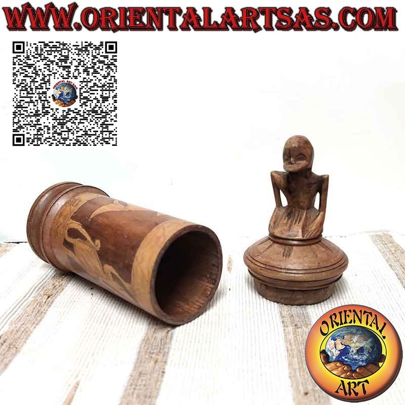 Bamboo medicine container and sculpture on Batak cap