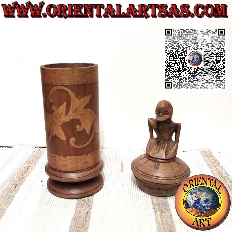 Bamboo medicine container and sculpture on Batak cap