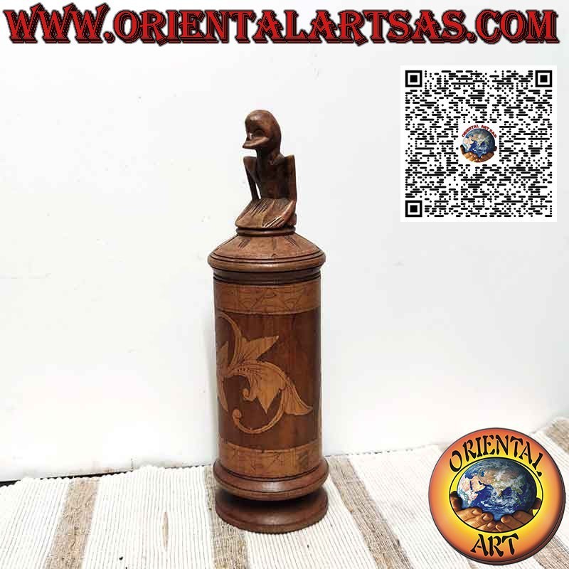 Bamboo medicine container and sculpture on Batak cap