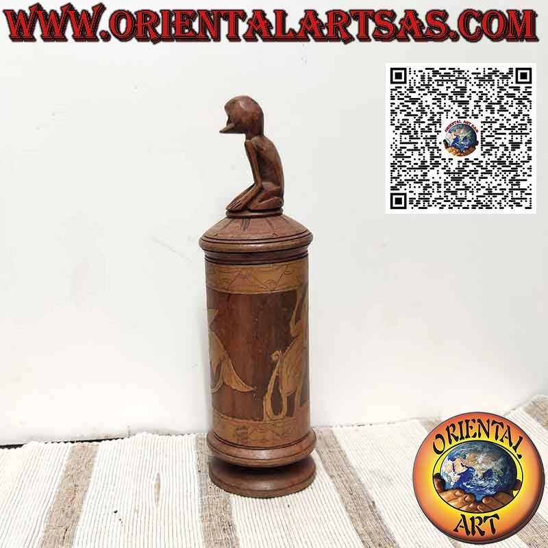 Bamboo medicine container and sculpture on Batak cap