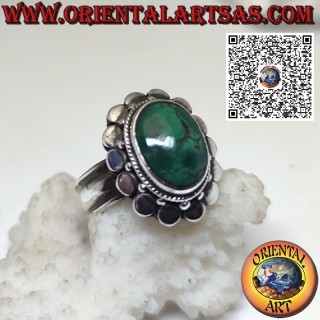 Silver ring with oval ancient Tibetan turquoise surrounded by studs