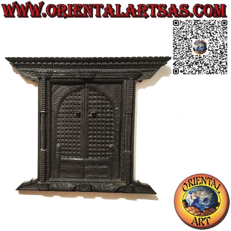 Miniature of typical carved wooden portal from Bhaktapur Nepal with 2 doors