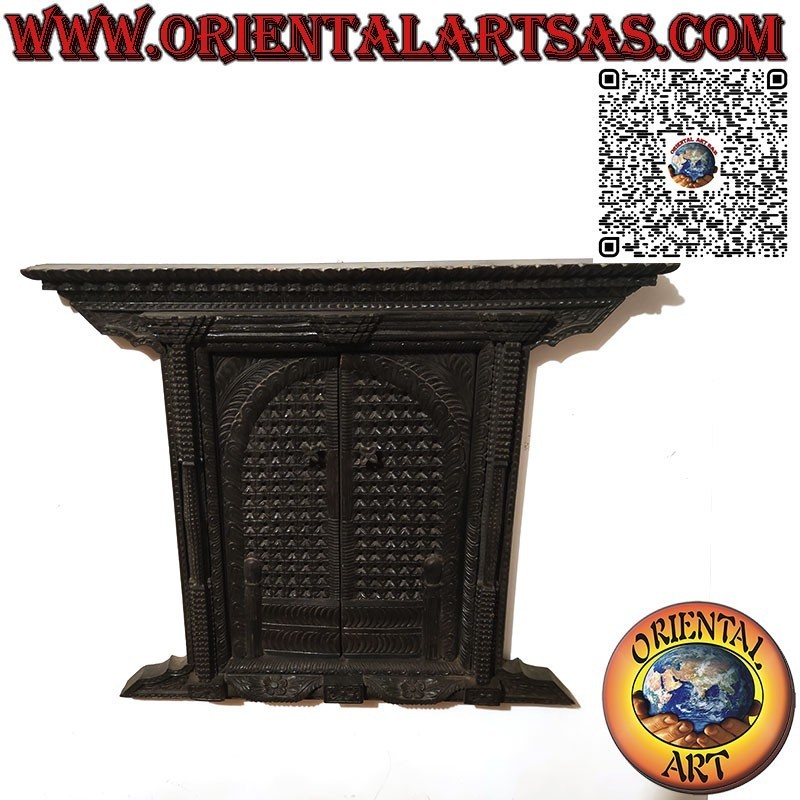 Small and ancient carved wooden 2-panel window Bhaktapur Nepal