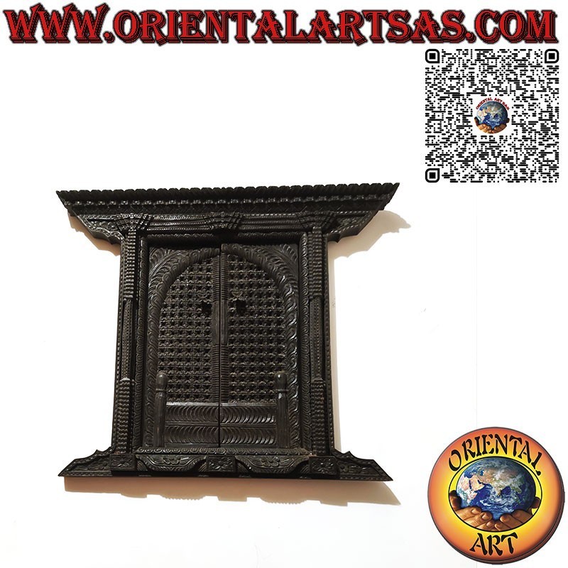 Small and ancient carved wooden 2-panel window Bhaktapur Nepal