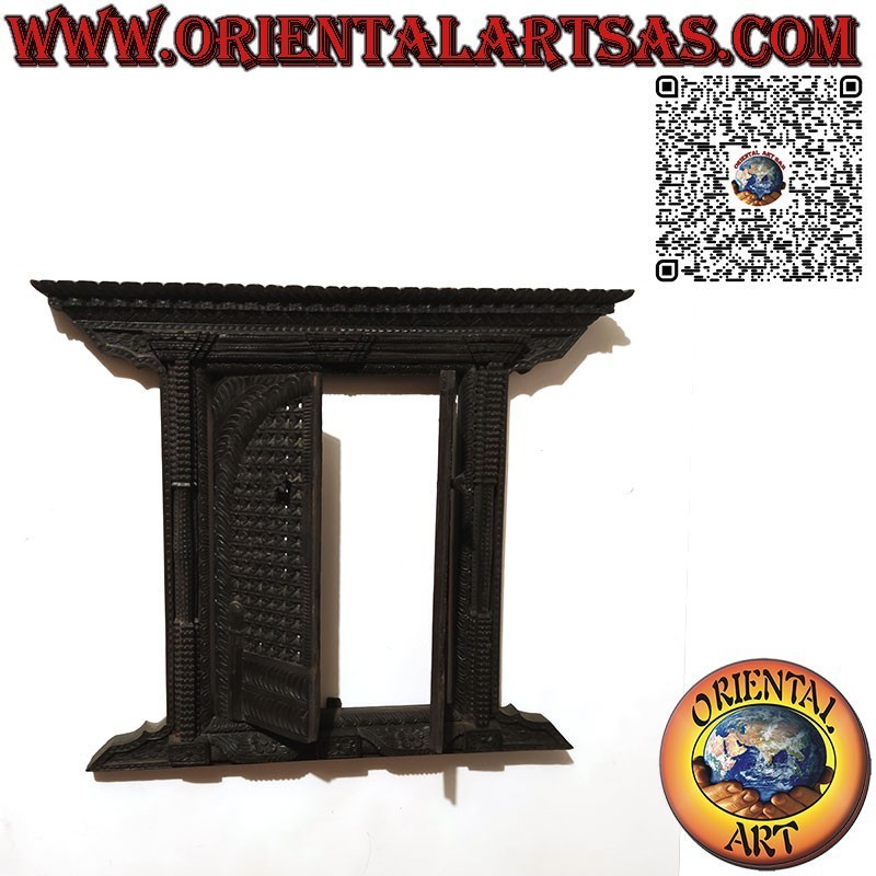 Small and ancient carved wooden 2-panel window Bhaktapur Nepal