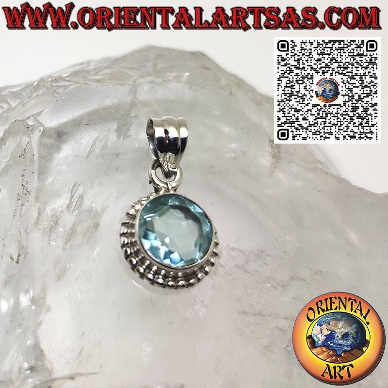 Silver pendant with round blue topaz surrounded by dots