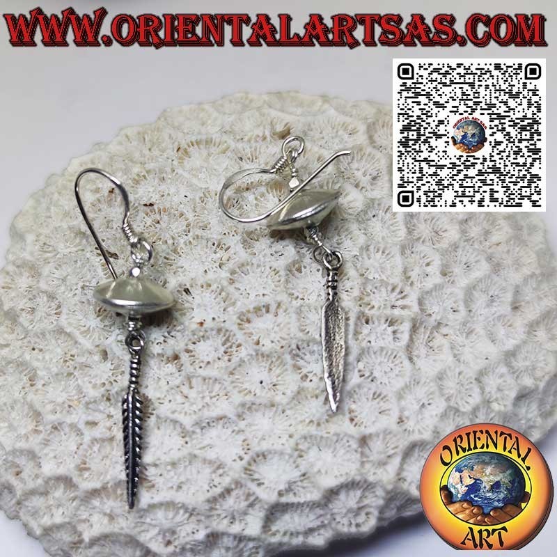 Silver earrings in the shape of a flying saucer spinning top with hanging feather