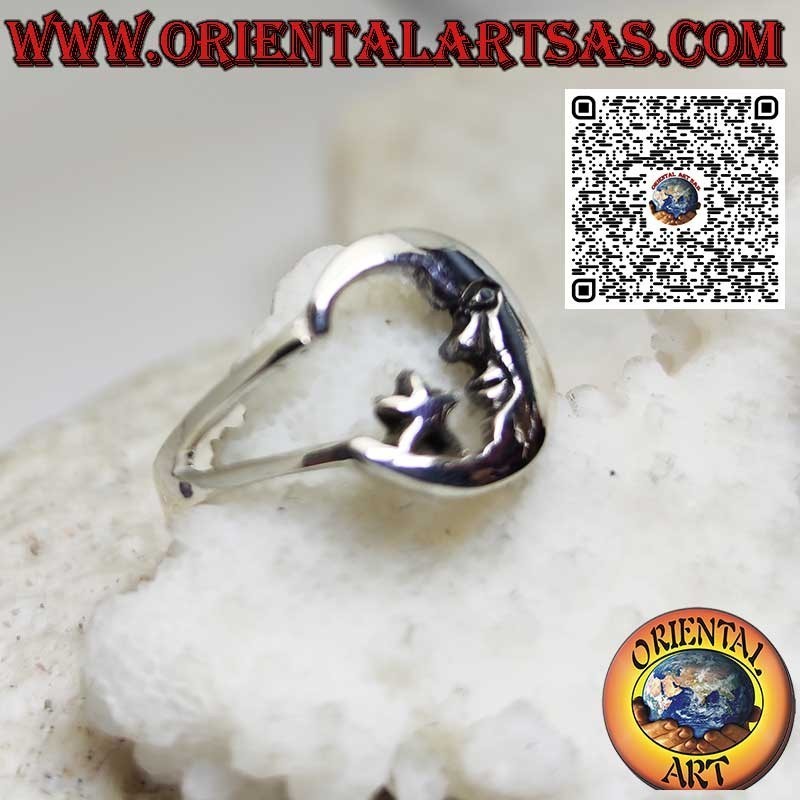 Silver ring depicting the moon with its face looking at the star