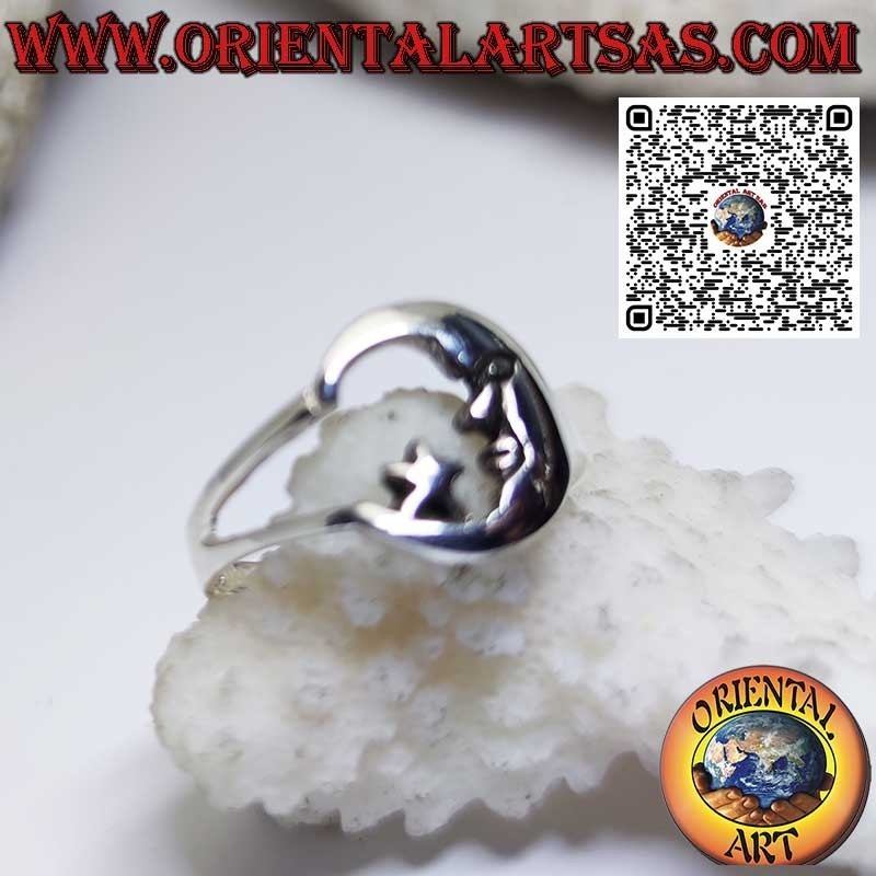 Silver ring depicting the moon with its face looking at the star