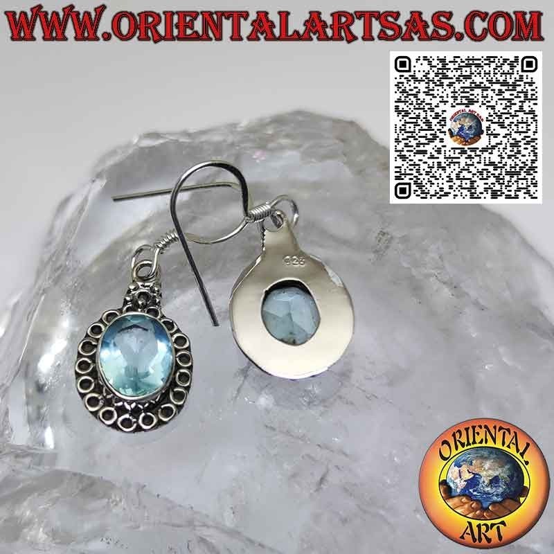 Silver earrings with blue topaz set and surrounded by circles