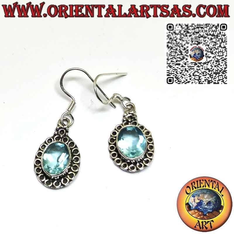 Silver earrings with blue topaz set and surrounded by circles