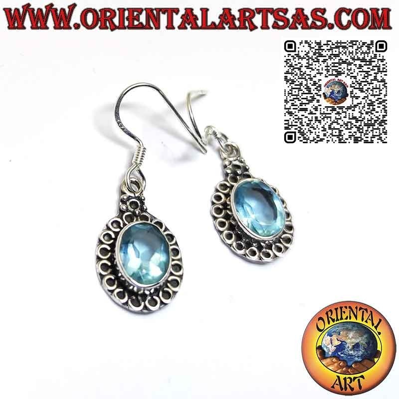 Silver earrings with blue topaz set and surrounded by circles