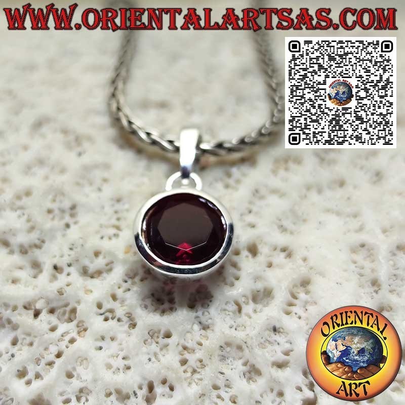 Silver pendant with oval garnet on a smooth high setting