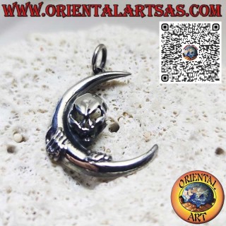 Silver pendant skull of darkness clinging to the moon