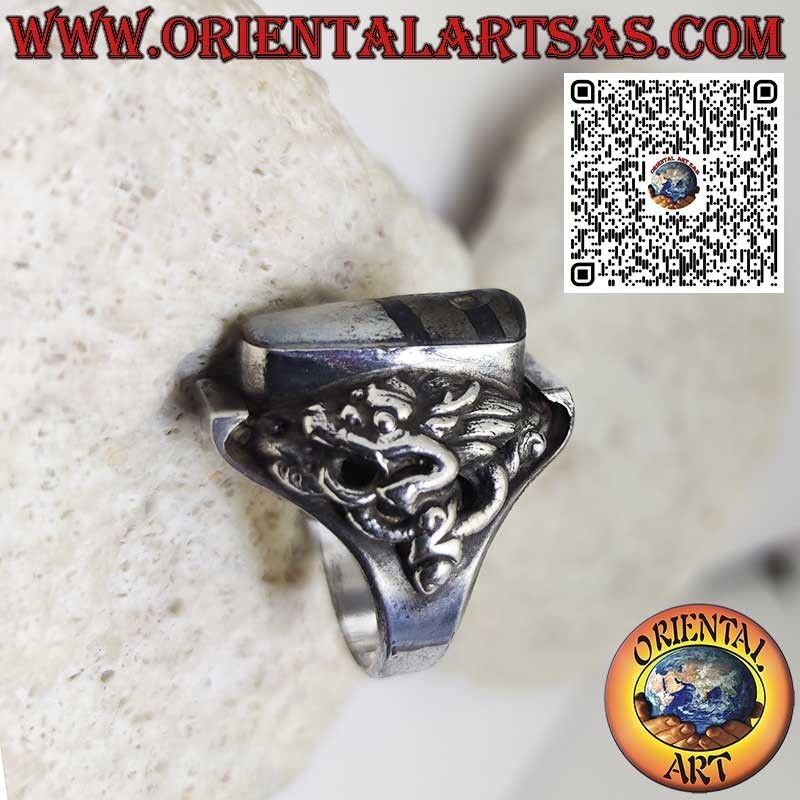 Silver ring with an ancient Tibetan Dzi and dragon in relief on the sides