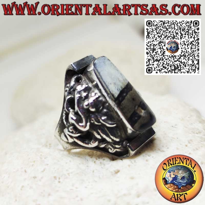 Silver ring with an ancient Tibetan Dzi and dragon in relief on the sides