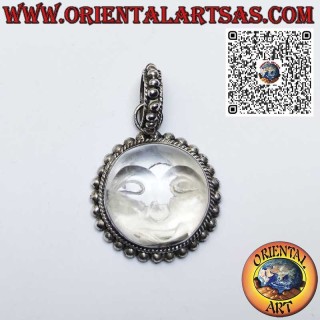 Silver pendant sun carved on rock crystal surrounded by spheres