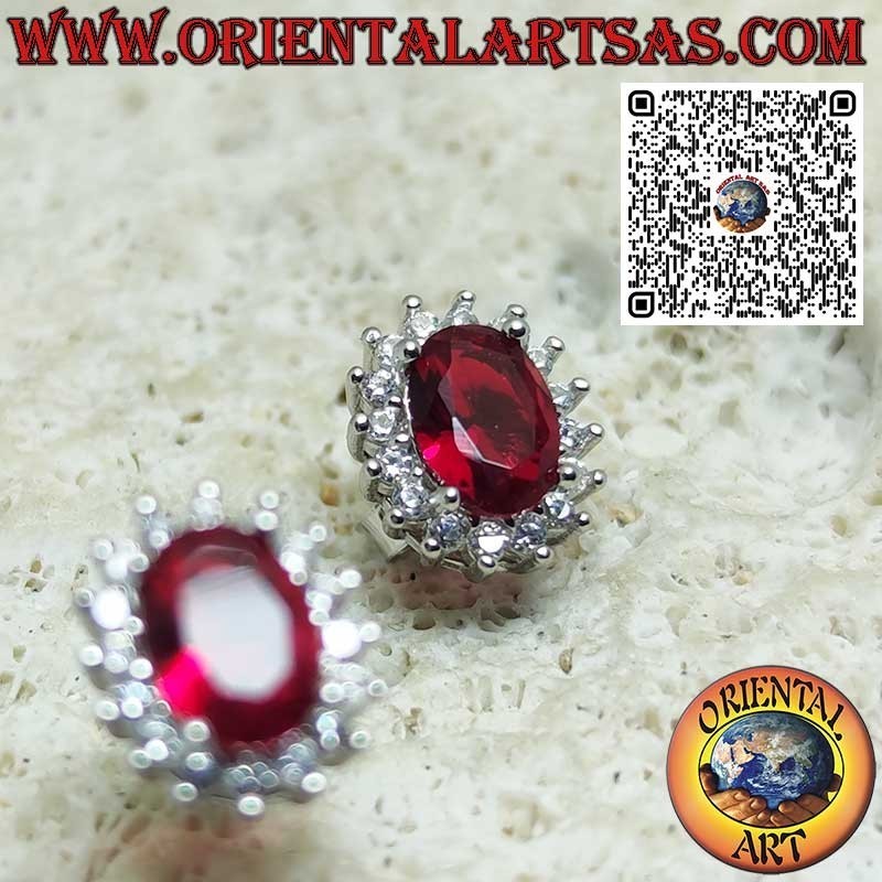 Silver lobe earrings with oval garnet surrounded by zirconia. small