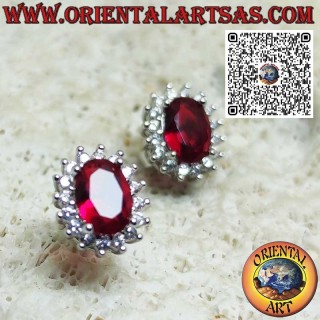 Silver lobe earrings with oval garnet surrounded by zirconia. small