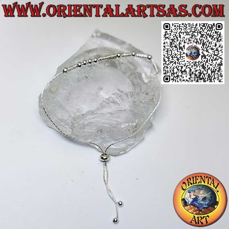 Silver bracelet with spheres and tubes with sliding ball closure