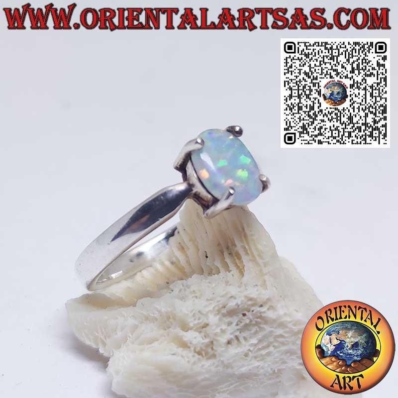 Silver ring with oval harlequin opal set in 4 prongs