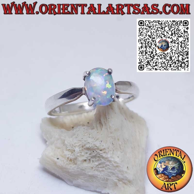 Silver ring with oval harlequin opal set in 4 prongs