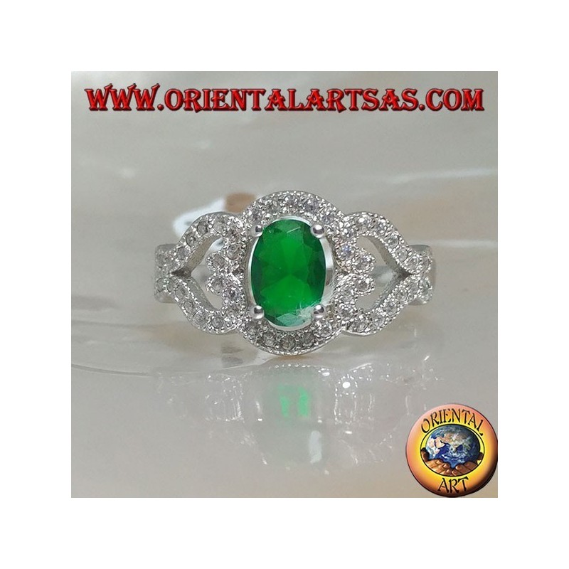 Silver ring with oval synthetic emerald on frame with hearts on the sides studded with zircons