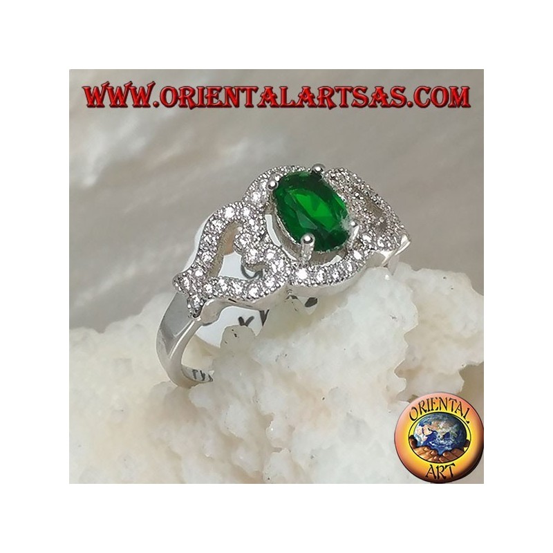Silver ring with oval synthetic emerald on frame with hearts on the sides studded with zircons