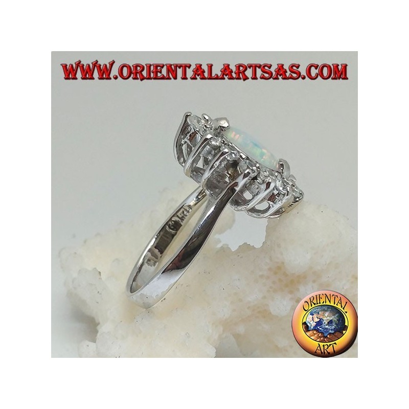 Anillo de plata con opalina arlequín lanzadera engastada en las puntas rodeadas de circonitas