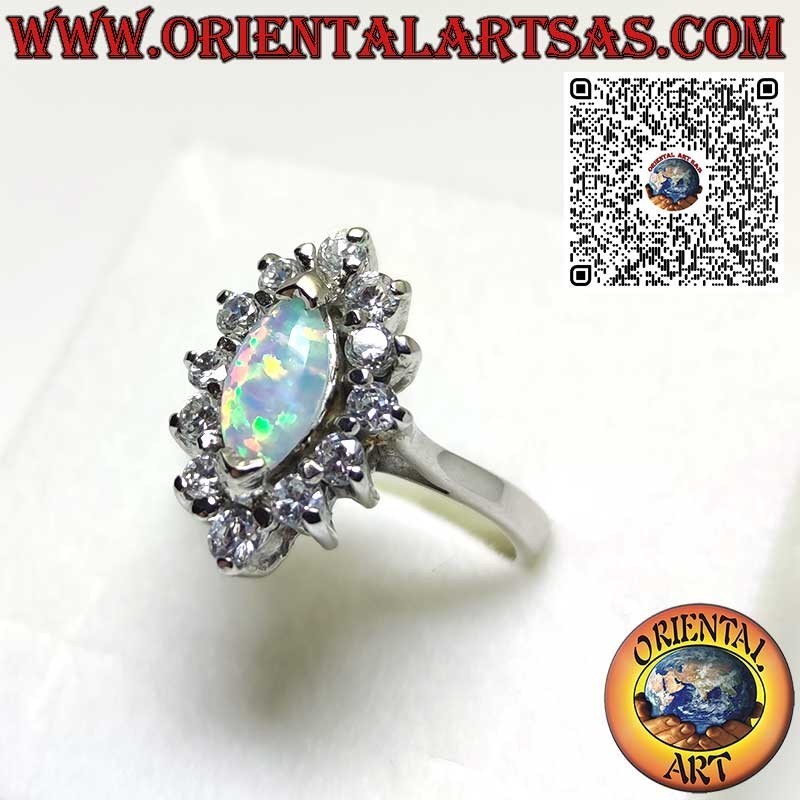 Silver ring with shuttle harlequin opal set on the tips surrounded by zircons