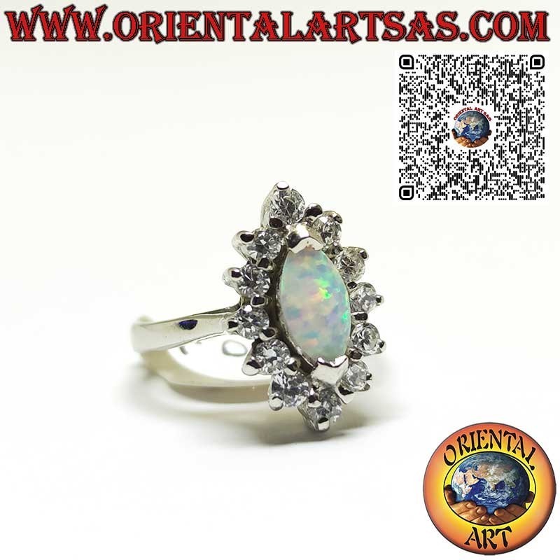 Silver ring with shuttle harlequin opal set on the tips surrounded by zircons
