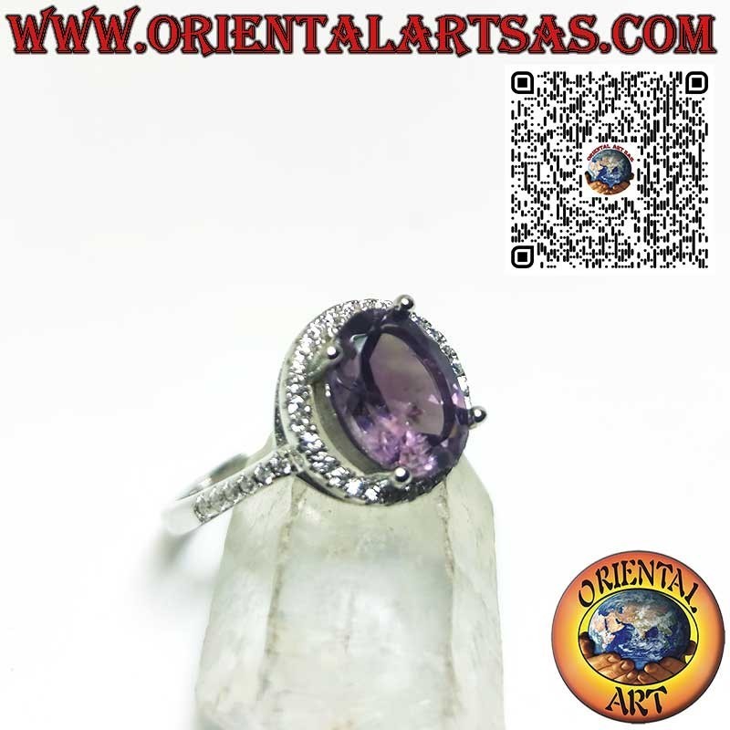 Silver ring with natural amethyst suspended on a circle of zircons
