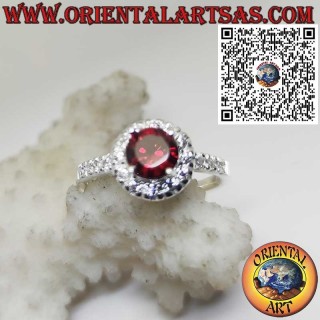 Sterling Silver Ring with Round Garnet and Side Zircon Accents