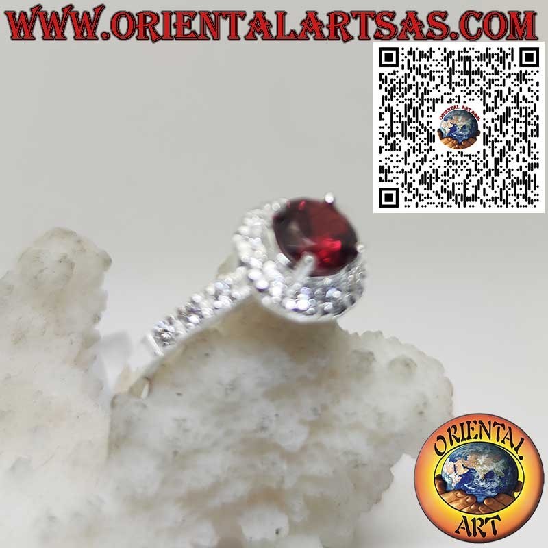 Sterling Silver Ring with Round Garnet and Side Zircon Accents