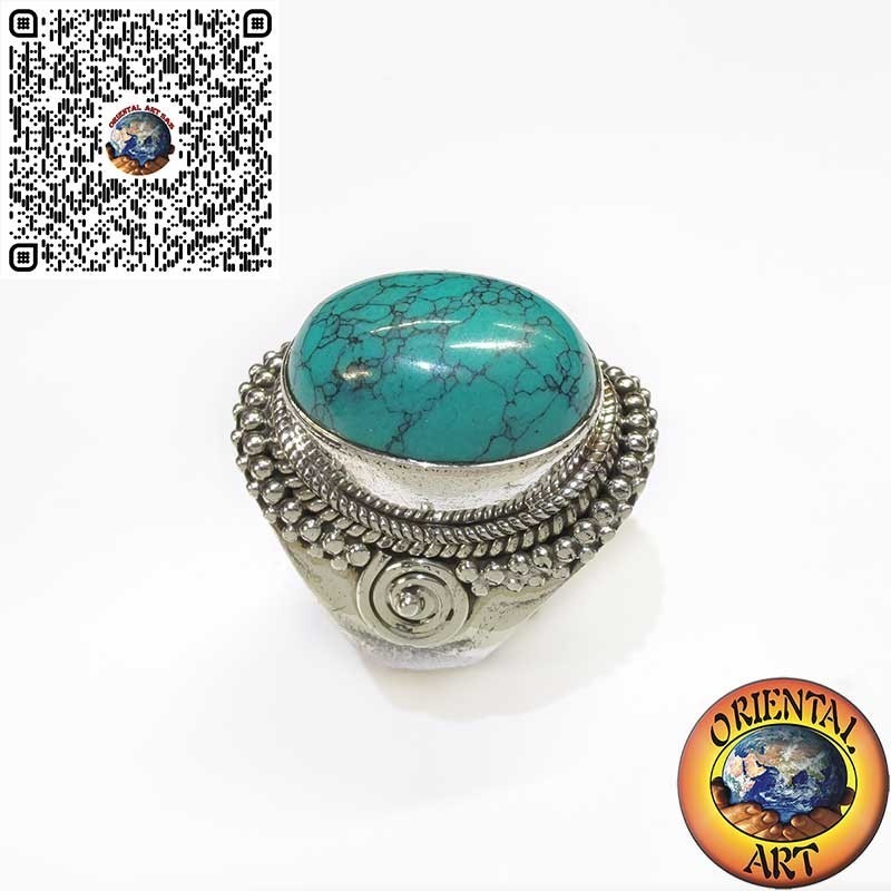 Bague en argent avec cabochon turquoise orné d'entrelacs et de spirale