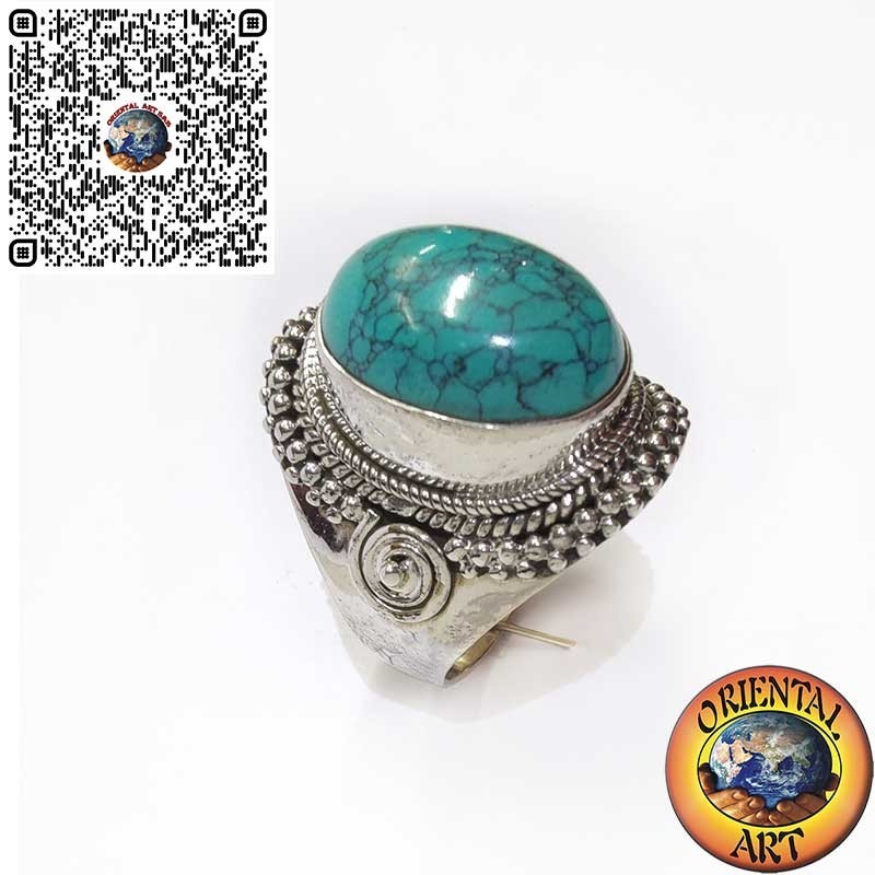 Silver ring with cabochon turquoise decorated with intertwining and spiral