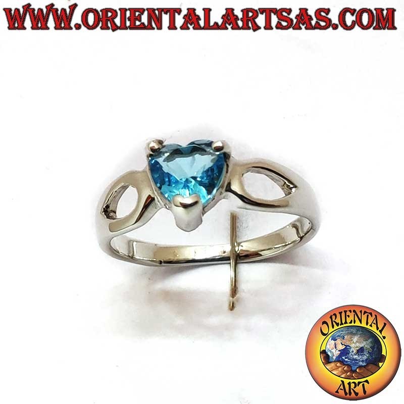 Bague argent 925 – Cœur topaze bleue 5x5 mm – Gouttelettes ajourées latérales – Hauteur 6 mm – Poids 1,5 gramme